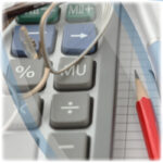 Close up of a calculator, pencil and glasses.