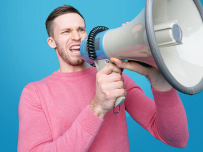 A man yelling into a megaphone.