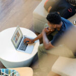 A man using a laptop at home.