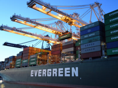 A large boat hauling shipping containers.