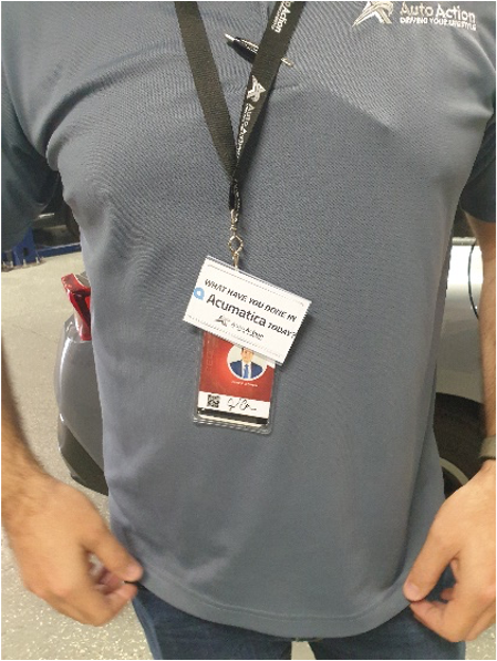 A man at an event with an Acumatica badge.