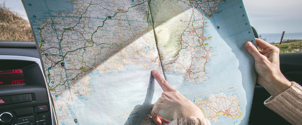 Close up of woman holding a roadmap.