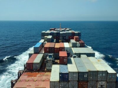 Barge filled with shipping containers.