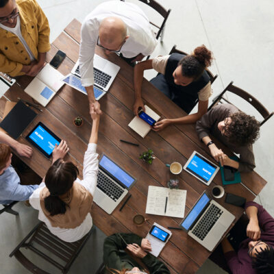 Team working around a conference tab.