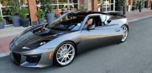 PC Bennett Solutions CEO, Patricia Bennett driving a sports car.