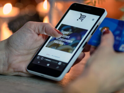 Person using cellphone to shop online.