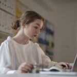 Young woman working on laptop.