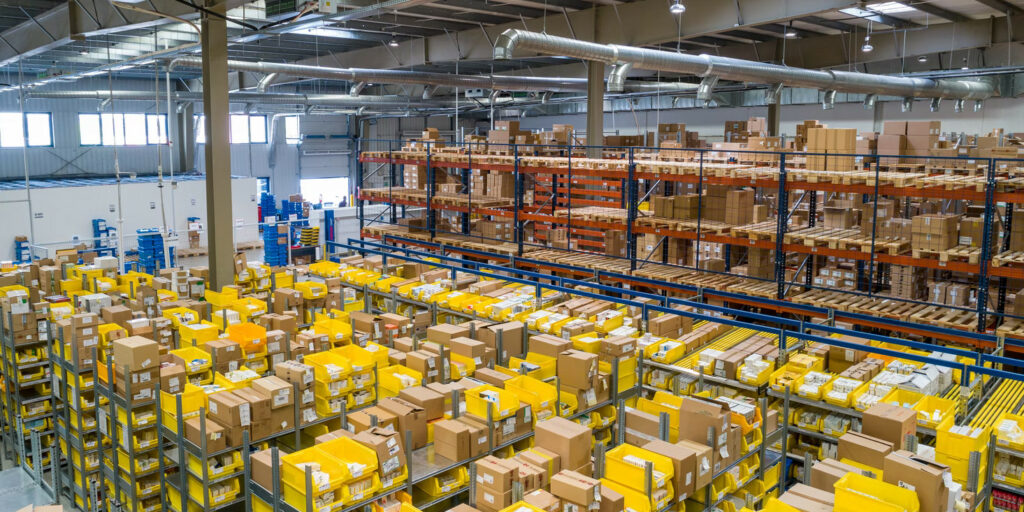 Warehouse filled with boxes on shelves.