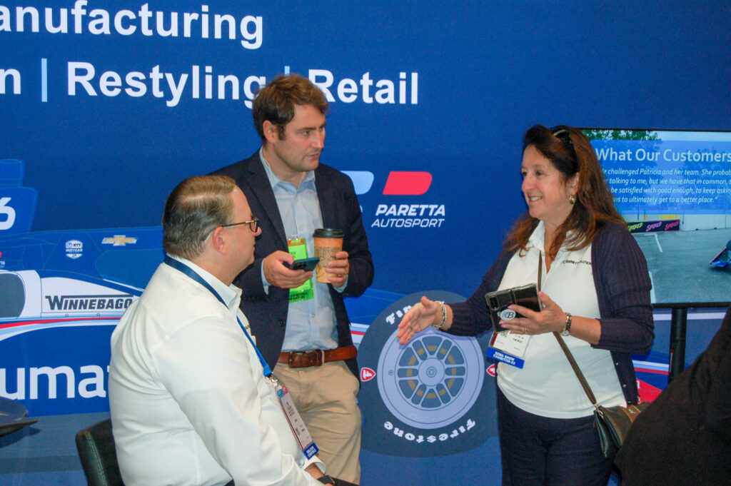 Patricia Bennett and Tim O'Sullivan chatting with a potential client at PRI 2022