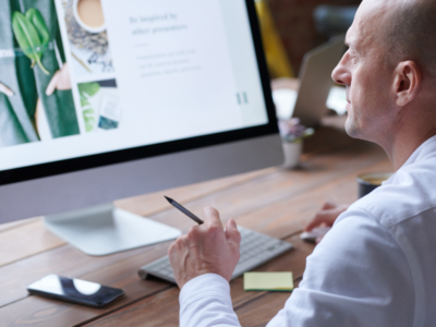Image of a person at a computer.