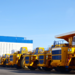 Heavy duty vehicles lined up in a lot, representing the types of businesses that can benefit from Acumatica's specialized solutions.