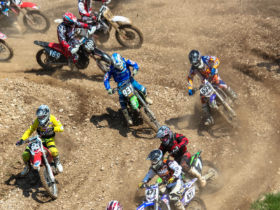 A group of dirt bikers going around a track. Acumatica Cloud ERP helps their companies race at the speed of business.