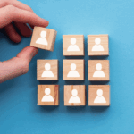 Image of blocks with people on them, indicating Dan Isaacson's promotion.