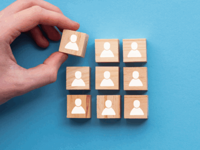 Image of blocks with people on them, indicating Dan Isaacson's promotion.